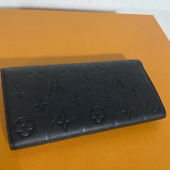 Authentic Louis Vuitton Emilie Monogram Empreinte Leather Wallet in black - Picture 6 of 9